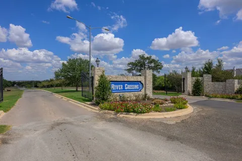 a view of a street with a building in the background
