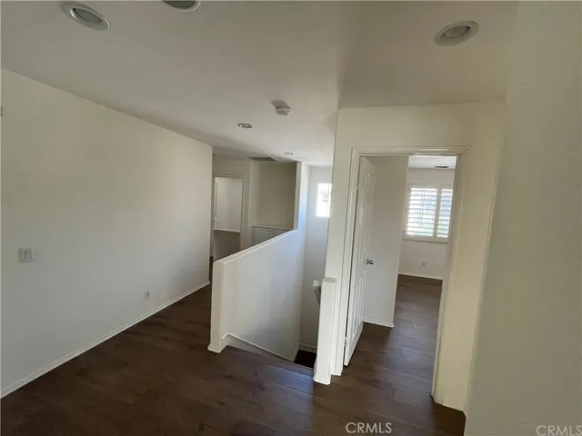 wooden floor in an empty room with a gallery