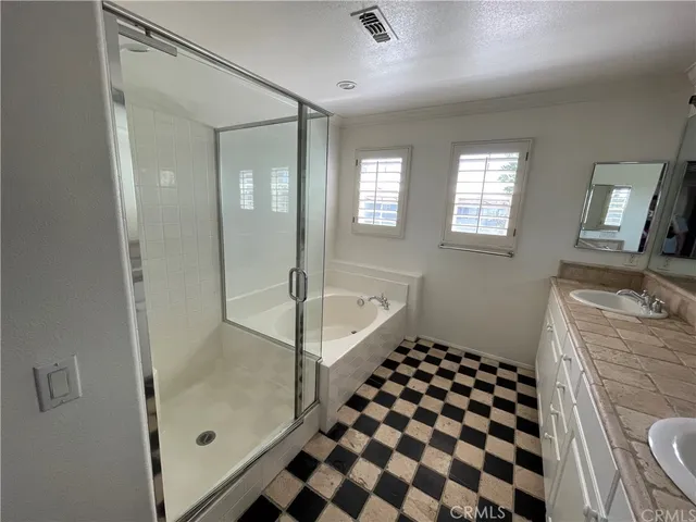 a bathroom with a bathtub and a shower