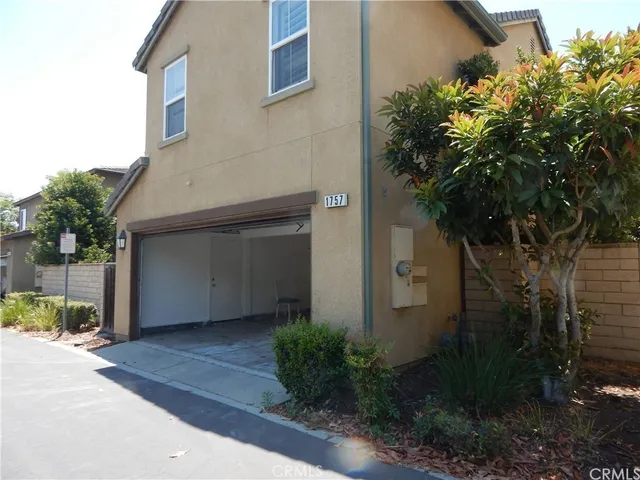 a house with a tree in front of it