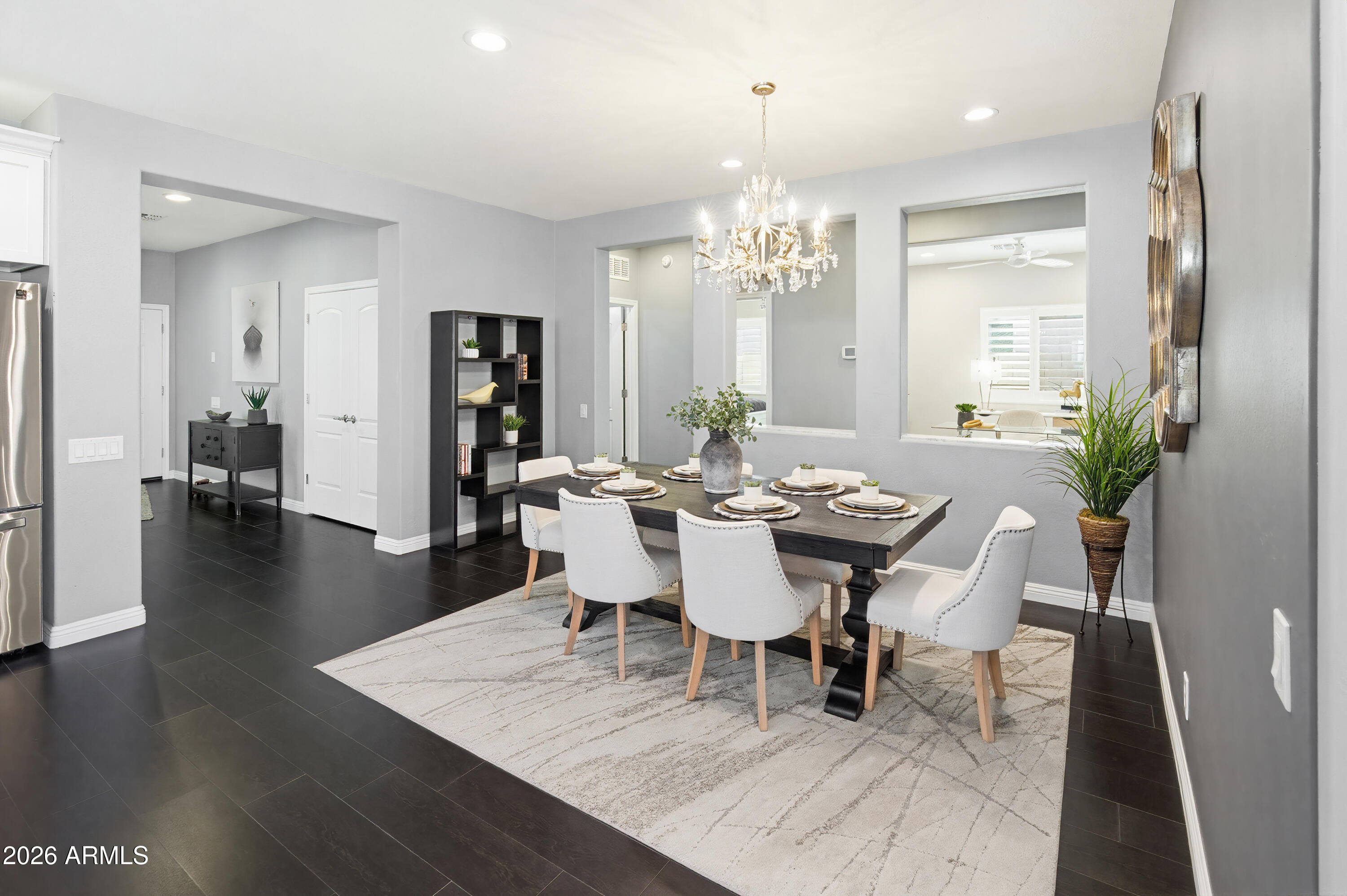 10772 West Yearling Road Peoria, AZ 85383 - Photo 13 of 39 a view of a dining room with furniture and wooden floor