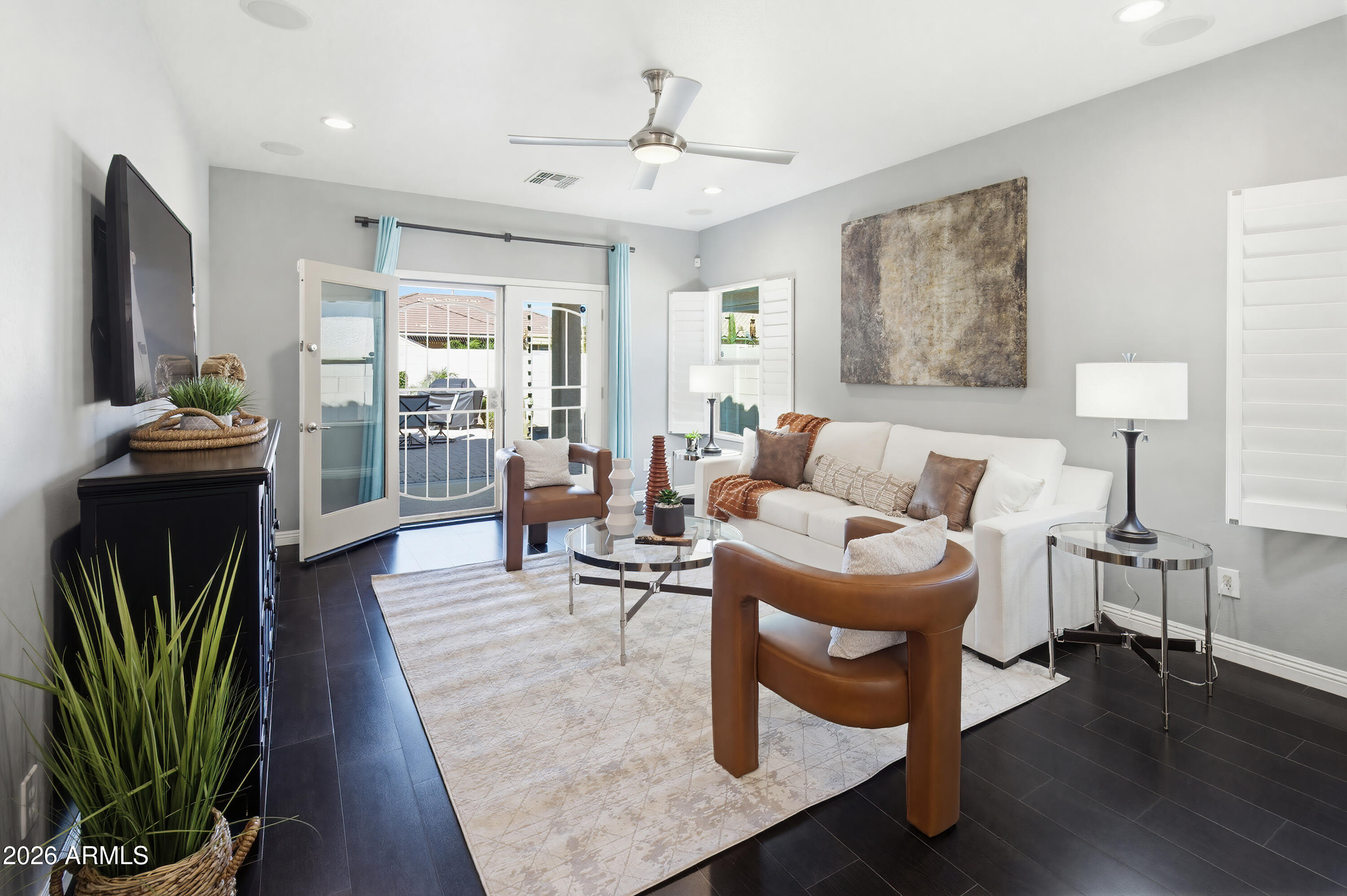 10772 West Yearling Road Peoria, AZ 85383 - Photo 15 of 39 a living room with furniture and a fireplace