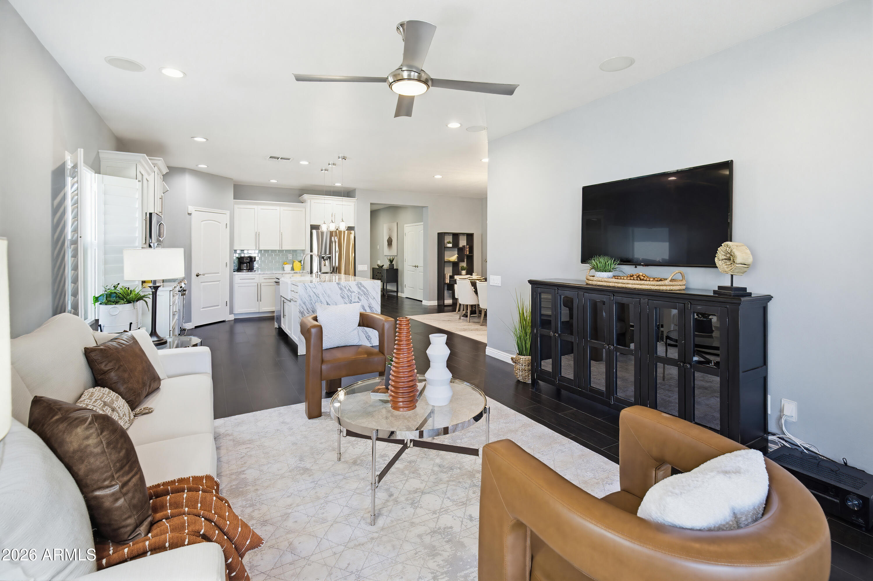 10772 West Yearling Road Peoria, AZ 85383 - Photo 16 of 39 a living room with furniture and a flat screen tv