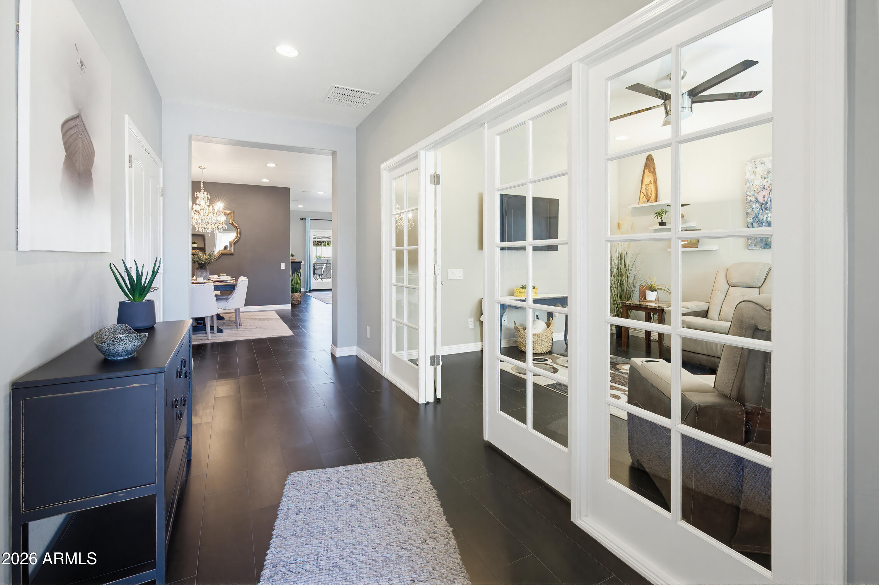 10772 West Yearling Road Peoria, AZ 85383 - Photo 17 of 39 a view of a living room and dining room