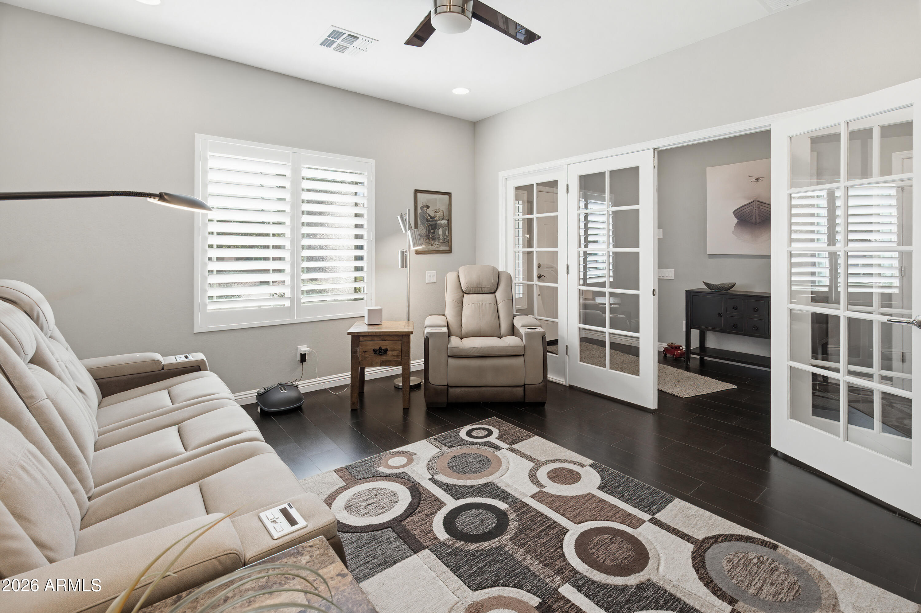 10772 West Yearling Road Peoria, AZ 85383 - Photo 19 of 39 a living room with furniture and a window