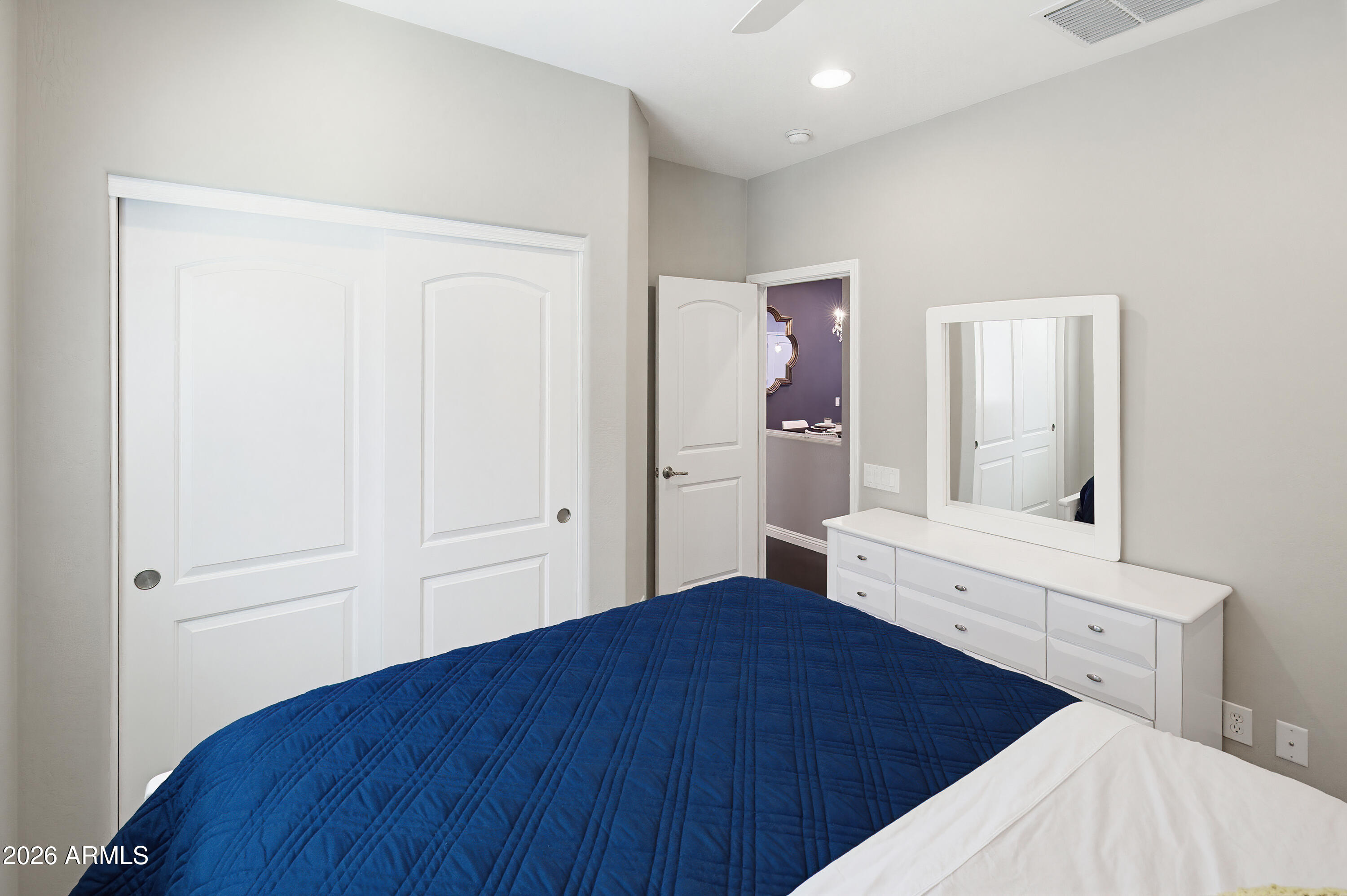 10772 West Yearling Road Peoria, AZ 85383 - Photo 22 of 39 a bedroom with a bed and a mirror