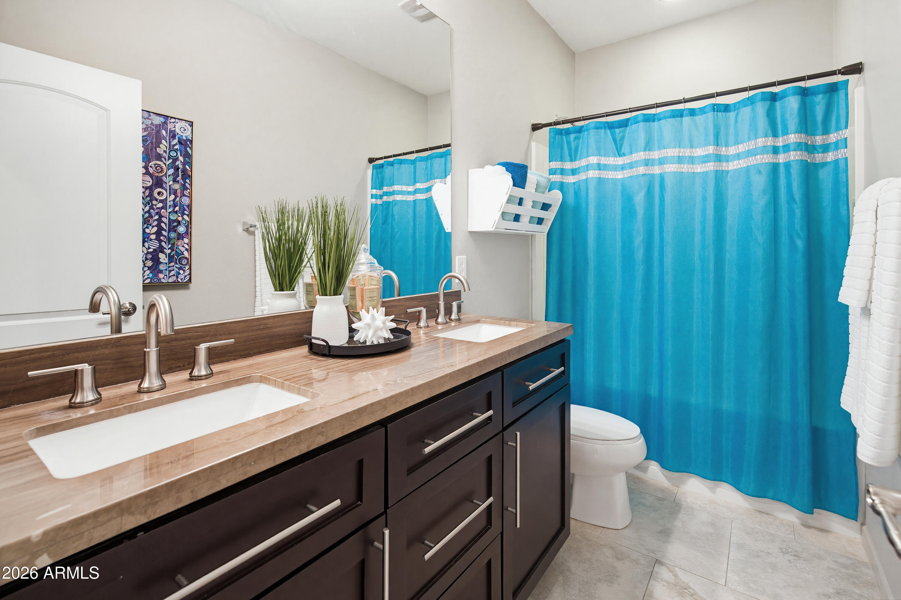 10772 West Yearling Road Peoria, AZ 85383 - Photo 24 of 39 a bathroom with a double vanity sink and a mirror