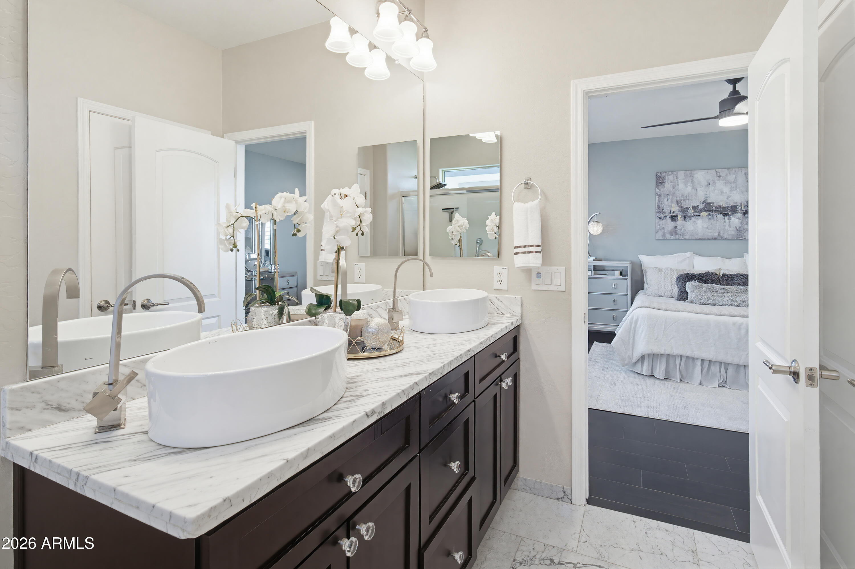 10772 West Yearling Road Peoria, AZ 85383 - Photo 27 of 39 a bathroom with a sink double vanity and a mirror