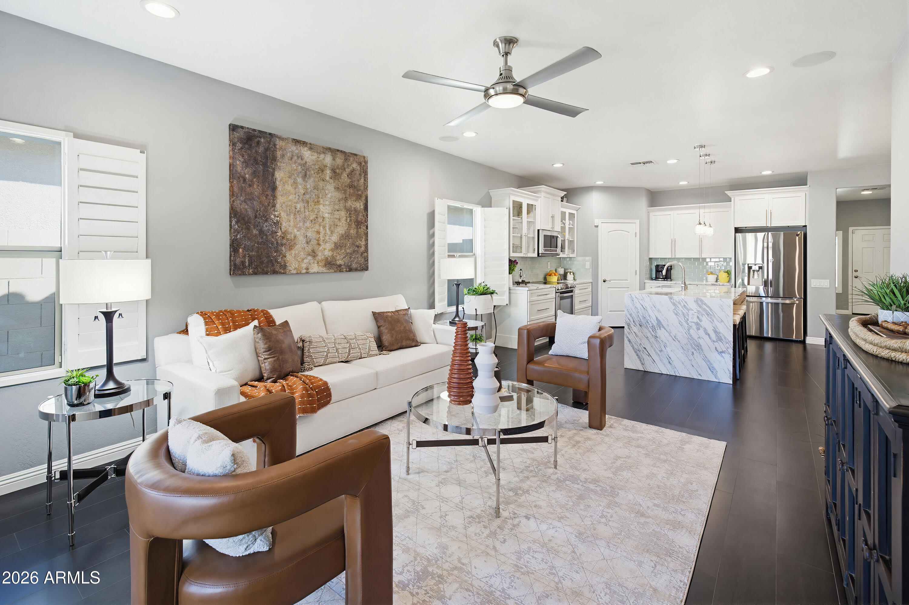 10772 West Yearling Road Peoria, AZ 85383 - Photo 4 of 39 a living room with furniture and a large window