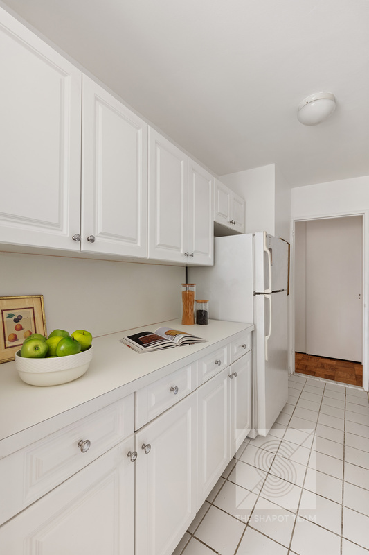 170 West End Avenue, Unit 2N Manhattan, NY 10023 - Photo 3 of 12 a kitchen with a cabinets and appliances