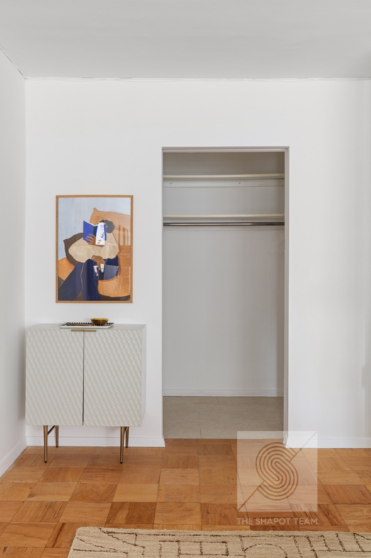 170 West End Avenue, Unit 2N Manhattan, NY 10023 - Photo 5 of 12 a view of a hallway with wooden floor