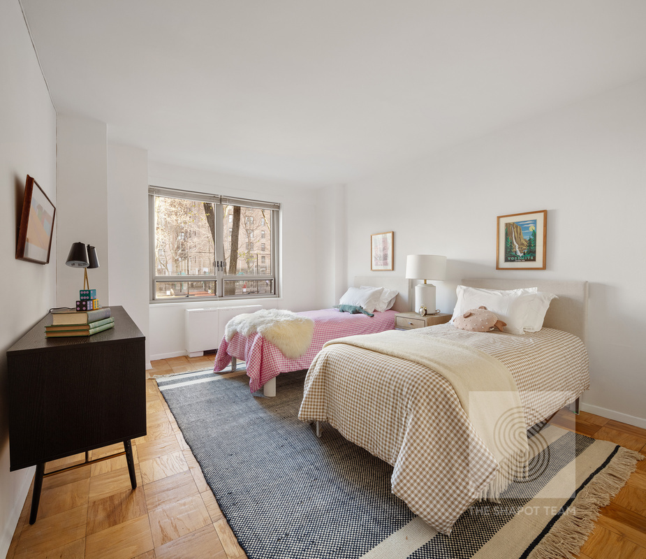 170 West End Avenue, Unit 2N Manhattan, NY 10023 - Photo 9 of 12 a bedroom with two beds and a window