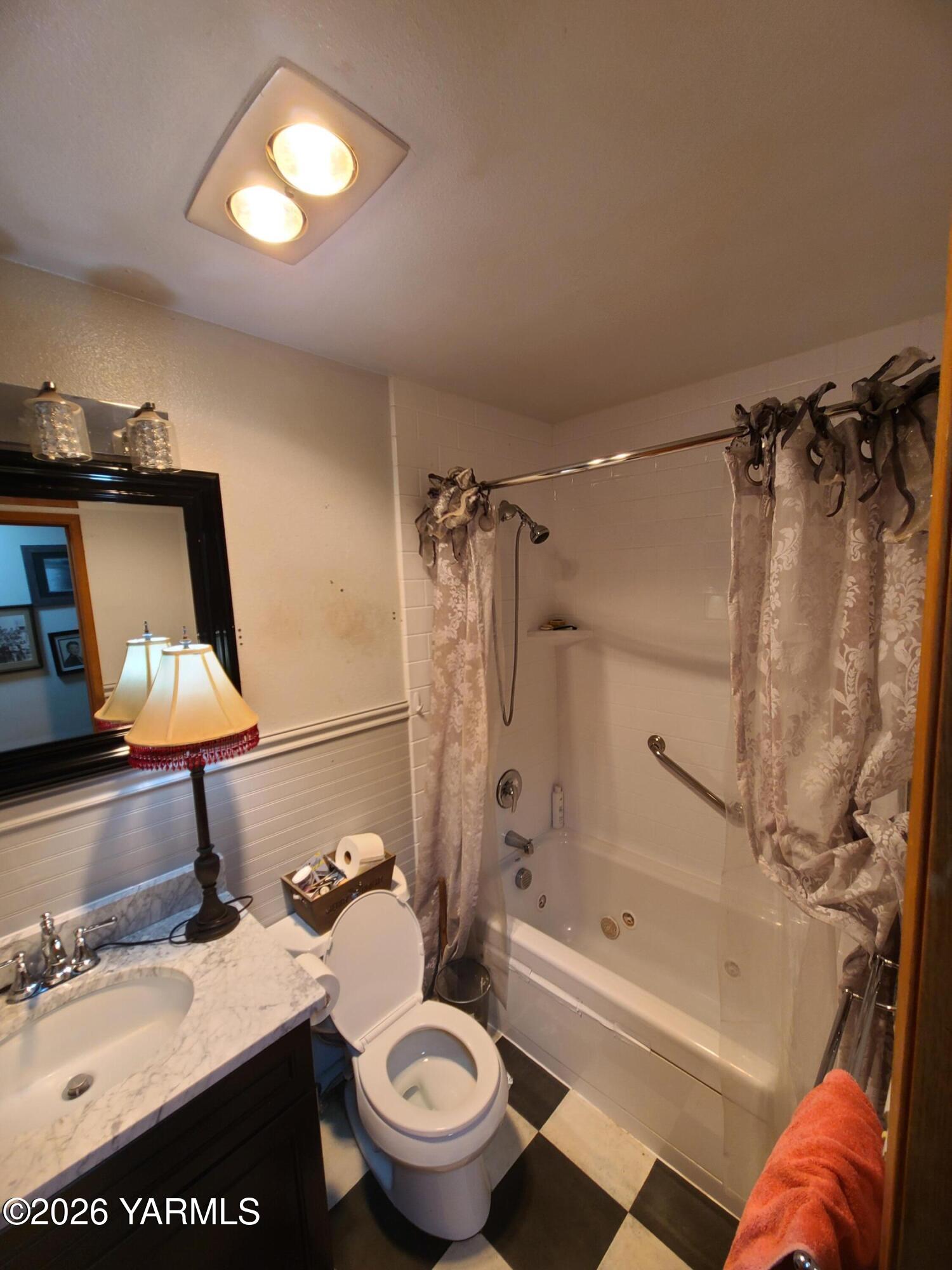 10608 Hackett Road Yakima, WA 98903 - Photo 12 of 25 a bathroom with a sink toilet and shower