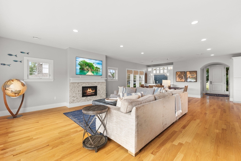 15 Buttonwood Lane Scituate, MA 02066 - Photo 11 of 42 a living room with furniture and a fireplace