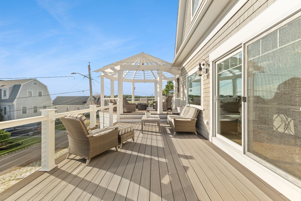 15 Buttonwood Lane Scituate, MA 02066 - Photo 15 of 42 a living room with furniture and a fireplace
