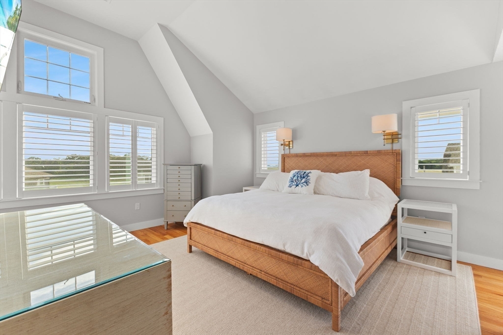 15 Buttonwood Lane Scituate, MA 02066 - Photo 18 of 42 a bed sitting in a bedroom next to a window