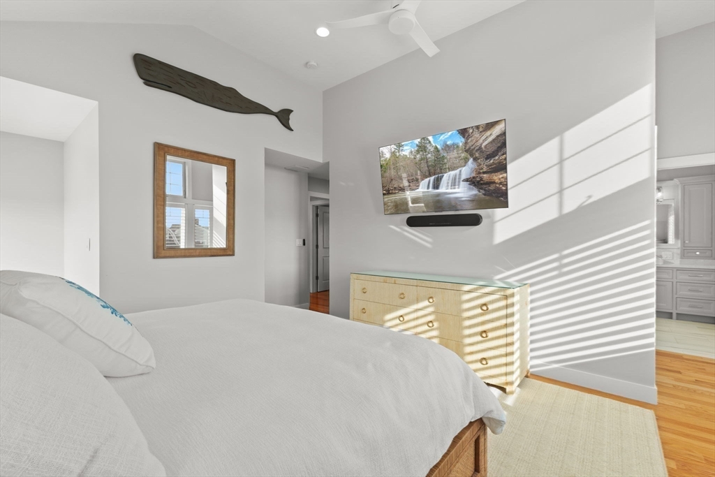 15 Buttonwood Lane Scituate, MA 02066 - Photo 19 of 42 a bedroom with a large bed and a window