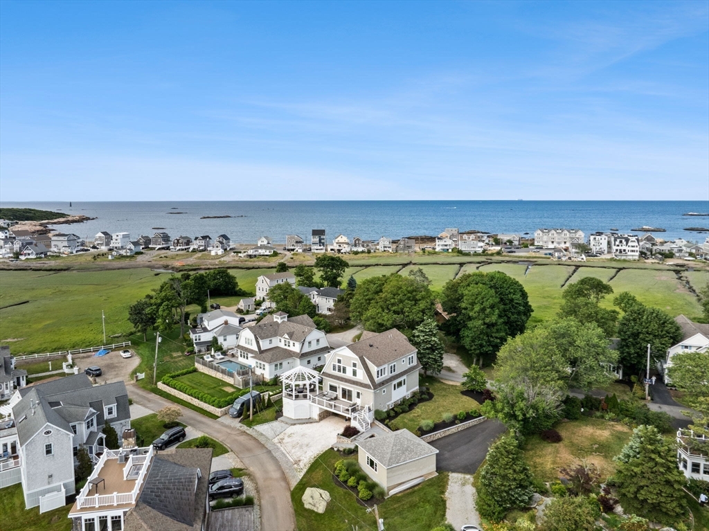 15 Buttonwood Lane Scituate, MA 02066 - Photo 2 of 42 an aerial view of a city with lots of residential buildings and ocean view in back