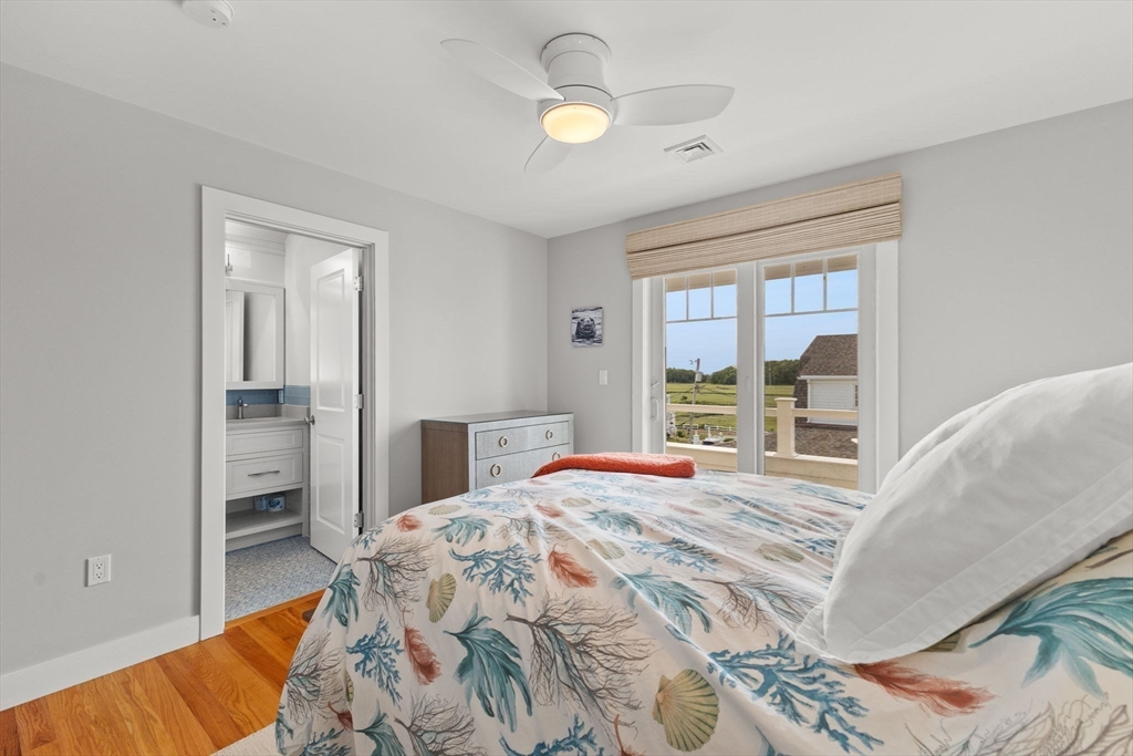 15 Buttonwood Lane Scituate, MA 02066 - Photo 25 of 42 a bedroom with a bed and a window