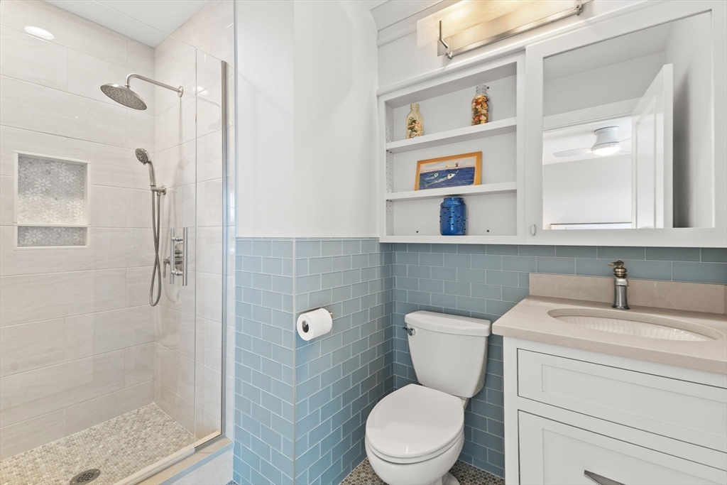 15 Buttonwood Lane Scituate, MA 02066 - Photo 26 of 42 a bathroom with a toilet sink and shower