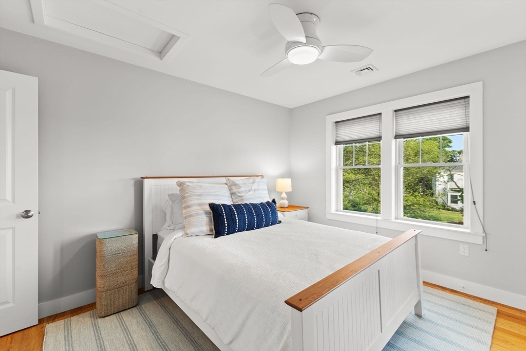 15 Buttonwood Lane Scituate, MA 02066 - Photo 27 of 42 a bedroom with a large bed and a large window