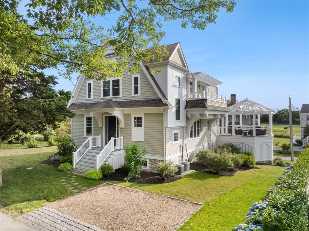 15 Buttonwood Lane Scituate, MA 02066 - Photo 3 of 42 a front view of a house with garden