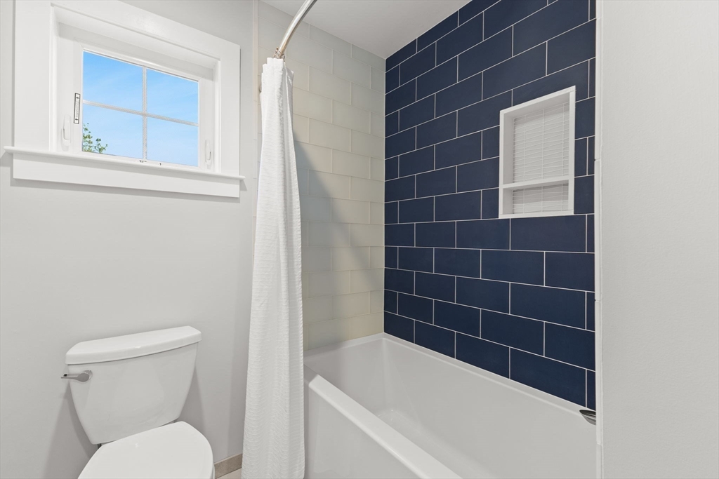 15 Buttonwood Lane Scituate, MA 02066 - Photo 31 of 42 a bathroom with a toilet and a bathtub