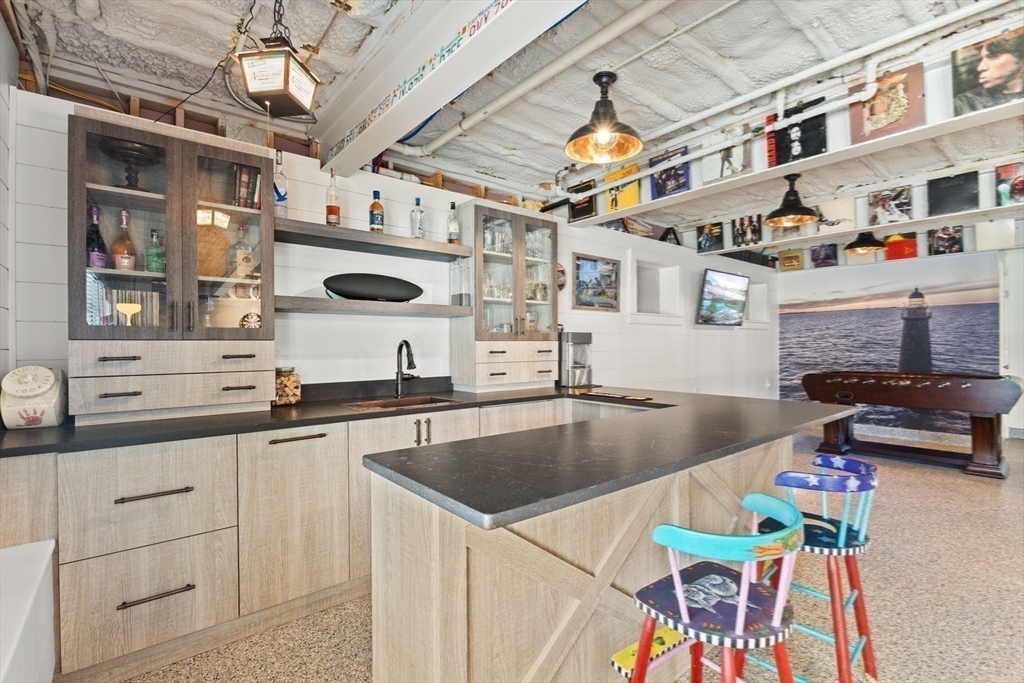 15 Buttonwood Lane Scituate, MA 02066 - Photo 36 of 42 a kitchen with a sink a counter and cabinets