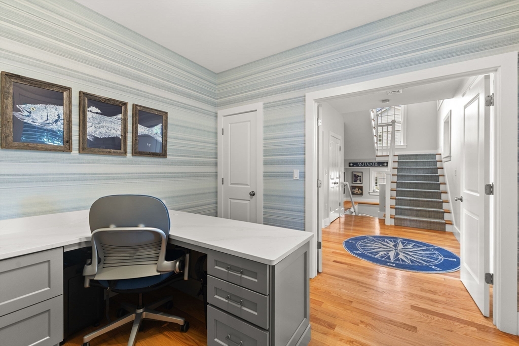 15 Buttonwood Lane Scituate, MA 02066 - Photo 6 of 42 a living room with a couch and a table with wooden floor