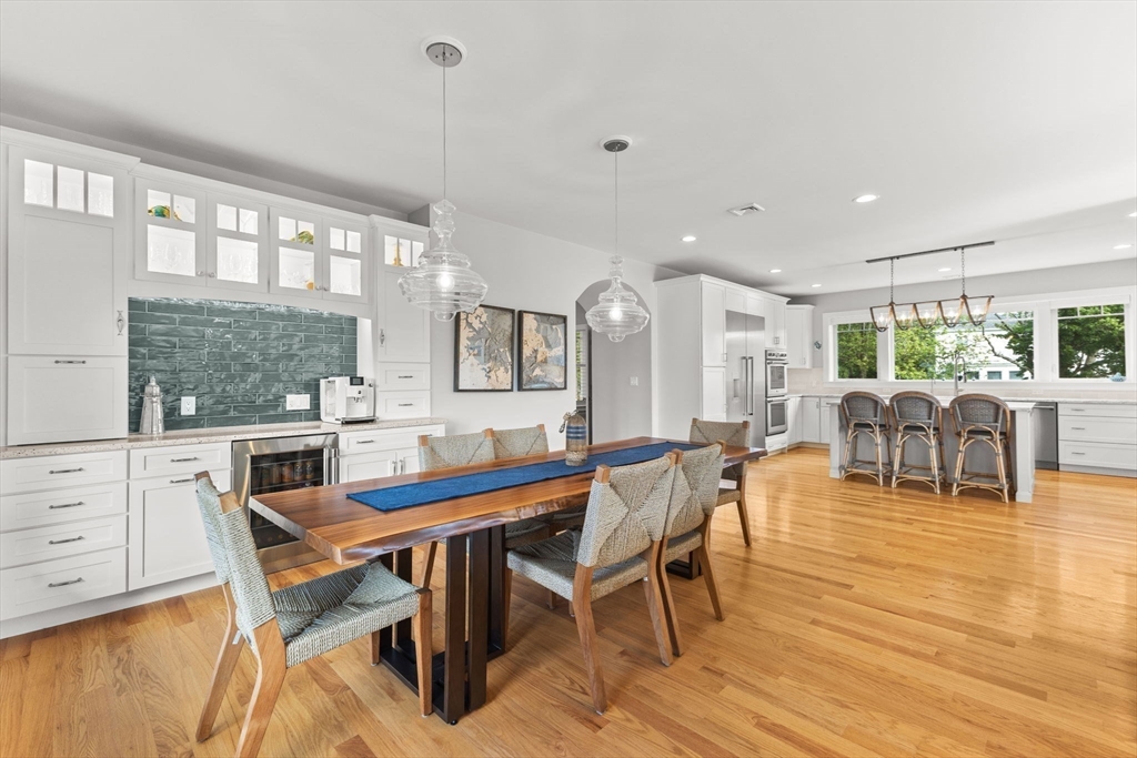 15 Buttonwood Lane Scituate, MA 02066 - Photo 8 of 42 a dining room with furniture a chandelier and wooden floor