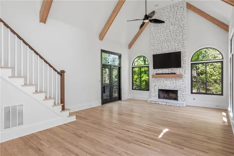 a view of a porch with furniture and garden