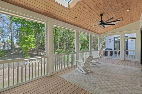 a view of a room with wooden floor