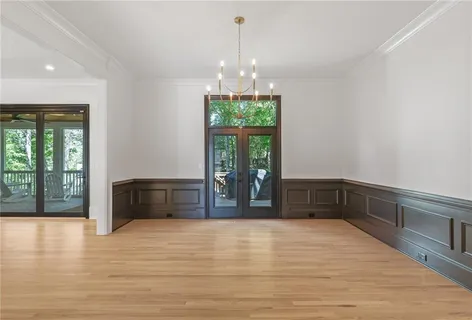 a view of an empty room with window and fire place
