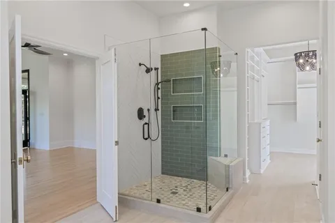 a spacious bathroom with a double vanity sink and a mirror