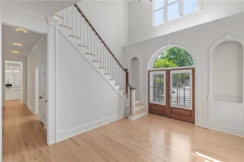 a kitchen with white cabinets stainless steel appliances and sink