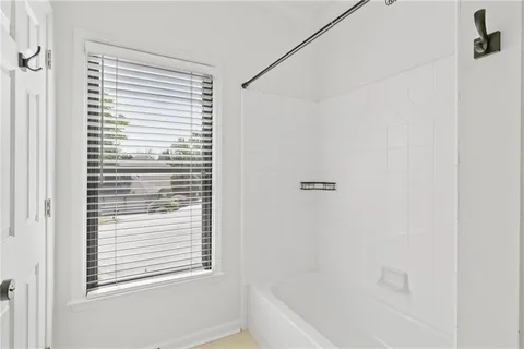 a spacious bathroom with a double vanity sink mirror and double