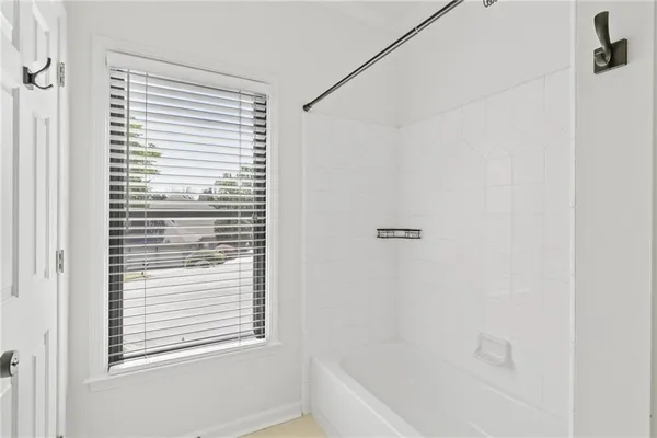 a spacious bathroom with a double vanity sink mirror and double