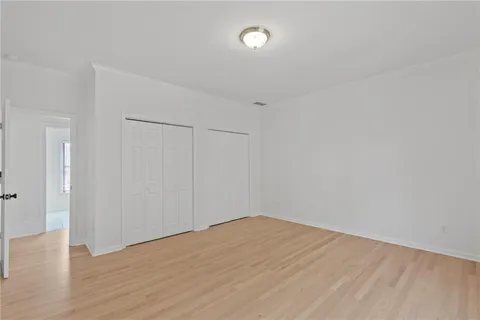 a view of a house with pool and sitting area