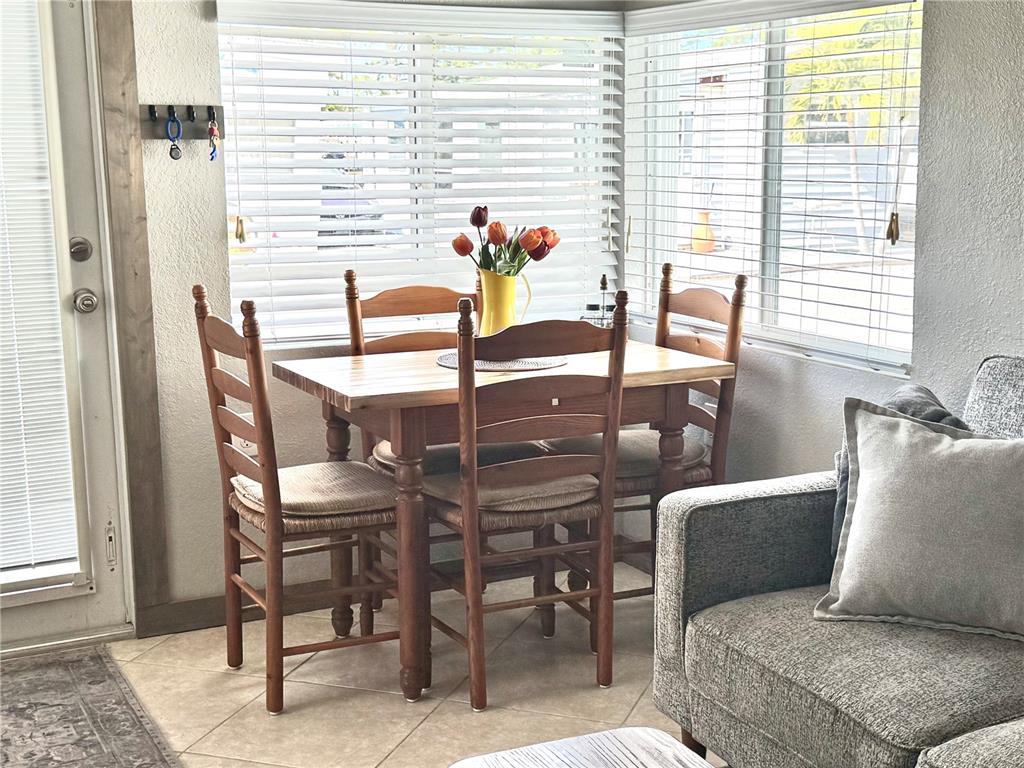 10315 Cortez Road West, Unit 643 Bradenton, FL 34210 - Photo 18 of 52 a dining room with furniture and window