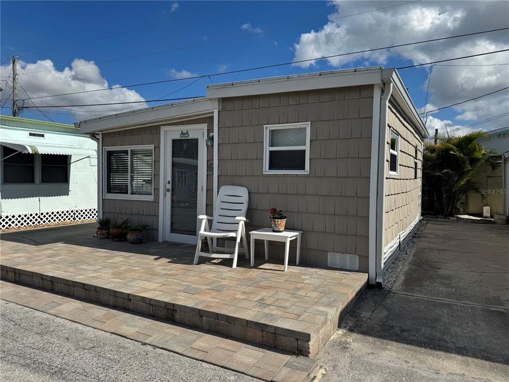 10315 Cortez Road West, Unit 643 Bradenton, FL 34210 - Photo 2 of 52 a backyard of a house with seating space