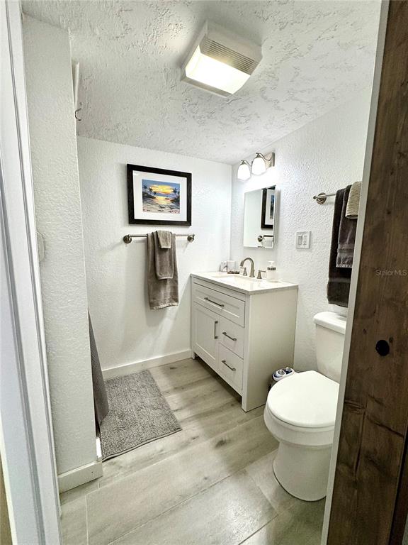 10315 Cortez Road West, Unit 643 Bradenton, FL 34210 - Photo 26 of 52 a bathroom with a toilet sink and mirror