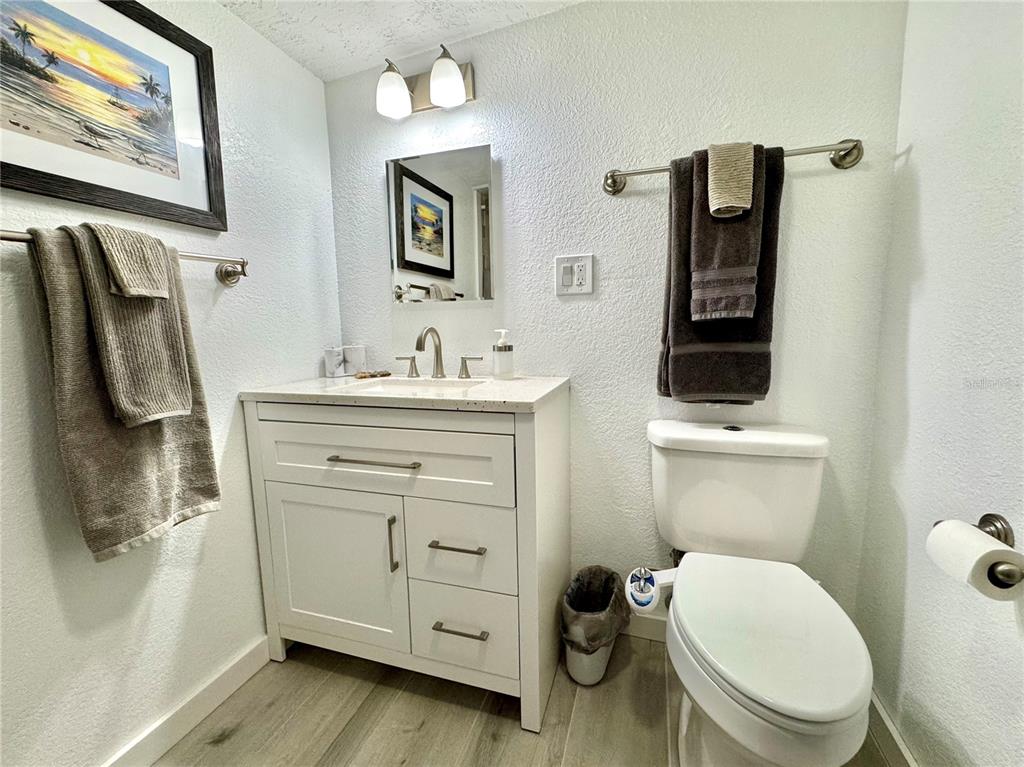 10315 Cortez Road West, Unit 643 Bradenton, FL 34210 - Photo 28 of 52 a bathroom with a toilet sink and mirror