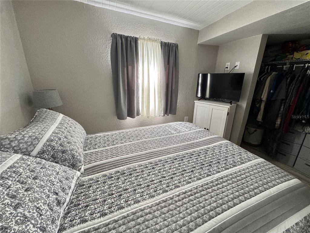 10315 Cortez Road West, Unit 643 Bradenton, FL 34210 - Photo 35 of 52 a bedroom with a bed and a television