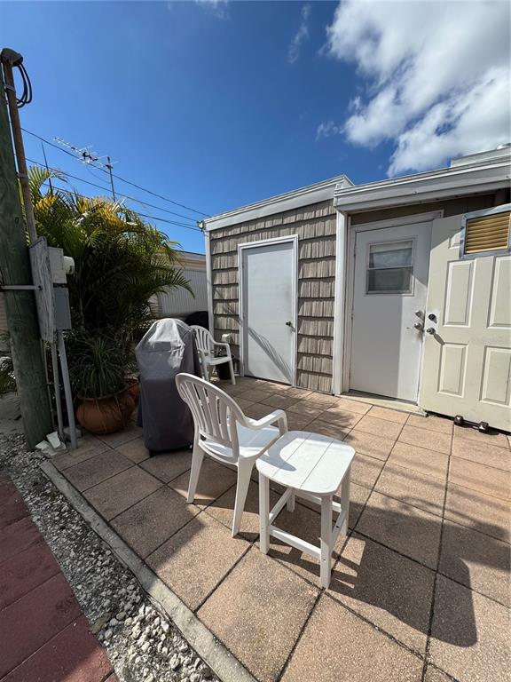 10315 Cortez Road West, Unit 643 Bradenton, FL 34210 - Photo 37 of 52 a patio with table and chairs