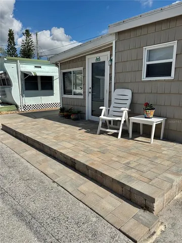a view of a swimming pool with a chair