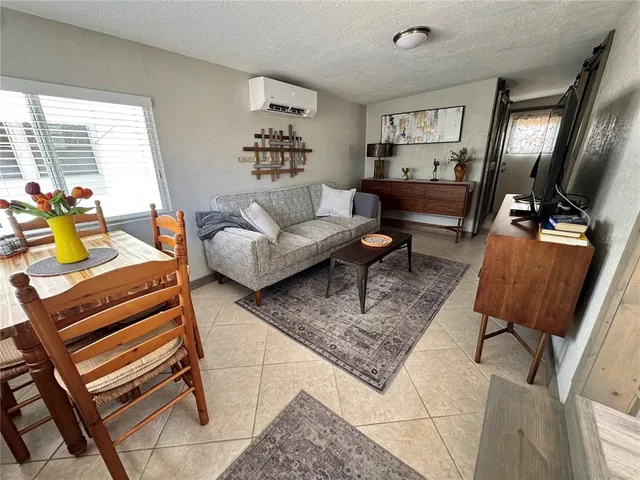 a living room with furniture and a rug