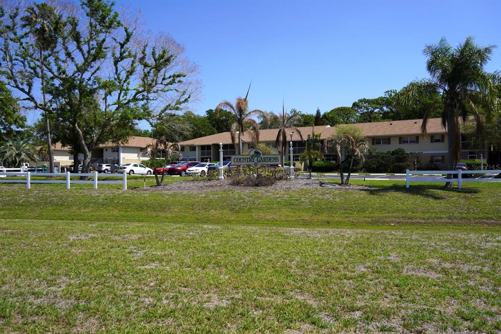 1664 Sunny Brook Lane, Unit 103 Palm Bay, FL 32905 - Photo 10 of 10 a view of outdoor space with garden and trees