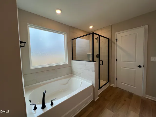 a bathroom with a double vanity sink and mirror