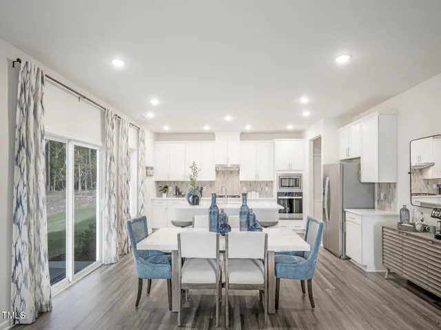 a kitchen with a sink stainless steel appliances and cabinets