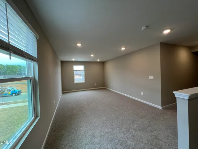 a kitchen with stainless steel appliances granite countertop a sink a oven a counter space and a center island